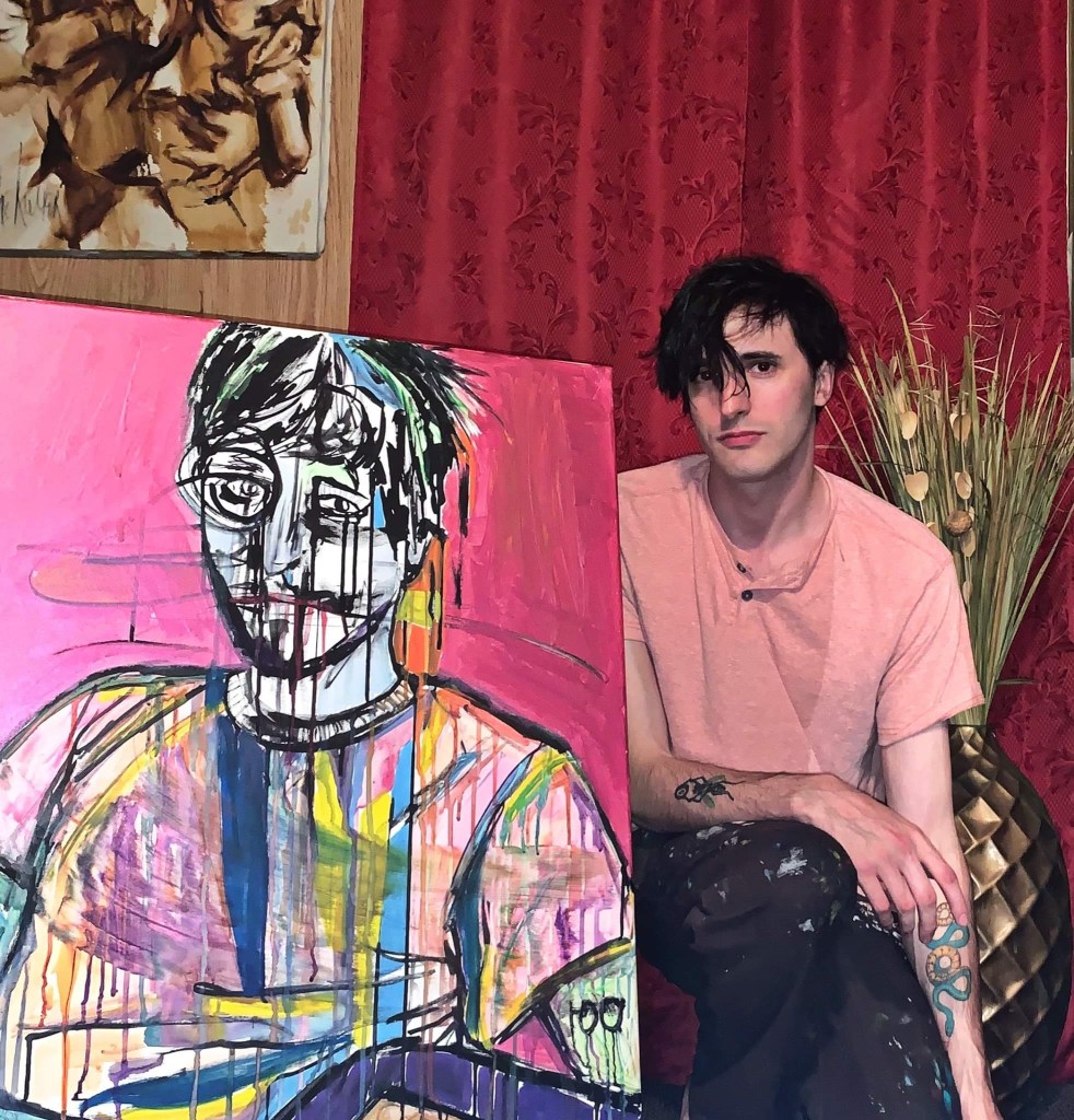 South Bend and Chicago Artist Russell Frantom poses with one of his self portrait paintings. 