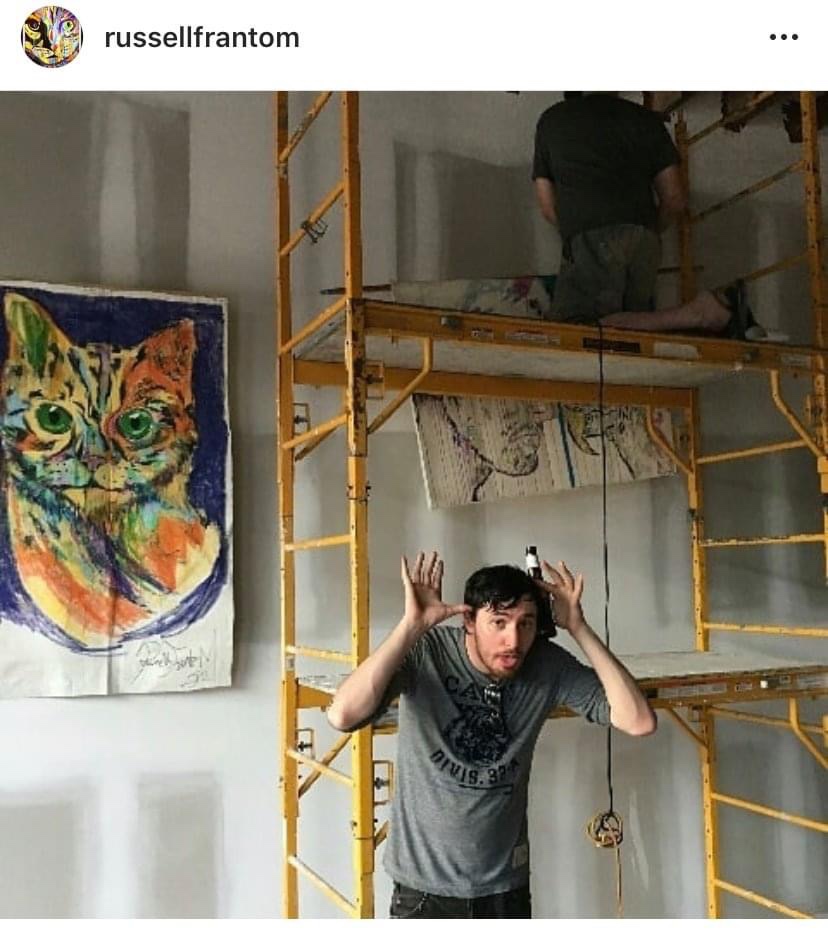 Russell frantom with cat painting “fire cat” in art gallery, Jacksonville Florida 2018 ​