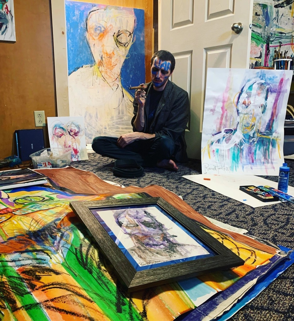 Artist Russell frantom in his studio in 2022 with recent abstract artworks ​