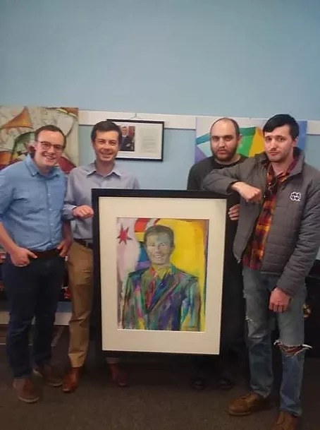 Visual artist Russell Frantom presents former mayor of South Bend Indiana pete buttigieg with a portrait painting. 2018