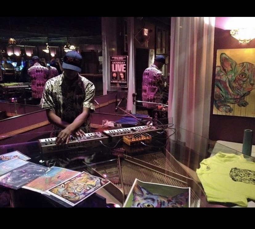 A dj plays music at a Russell frantom art show in Jacksonville Florida 2016 