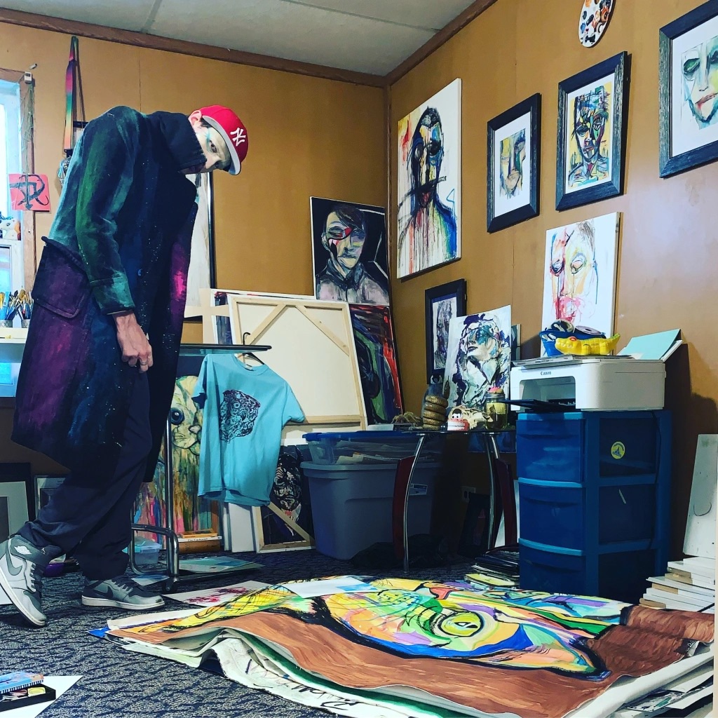 Artist Russell Frantom stands in his art studio in 2022 